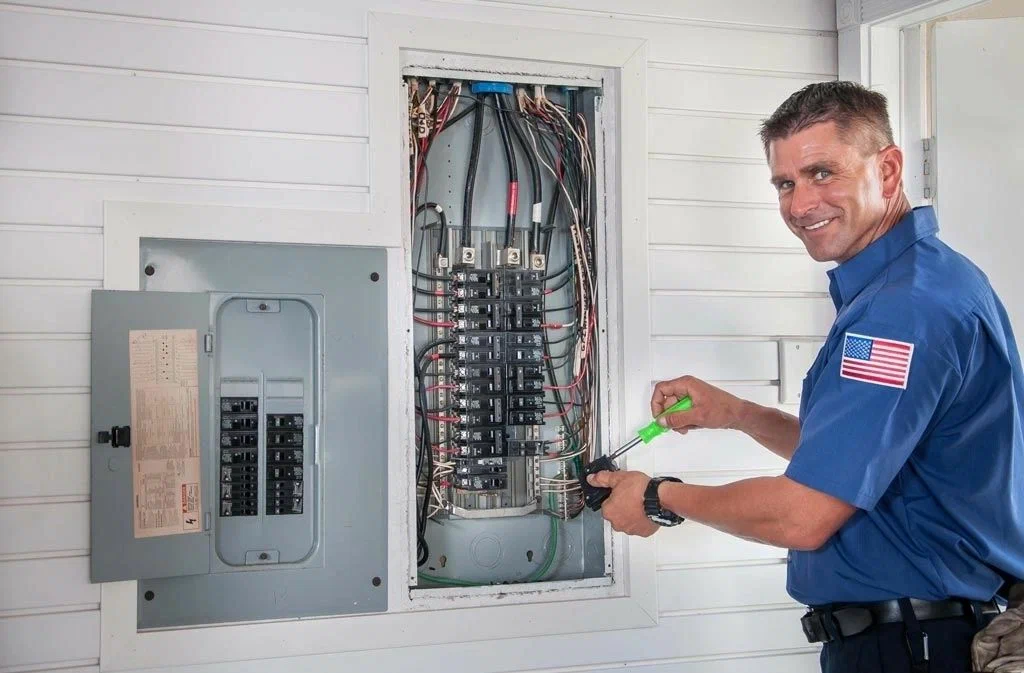 Certified electrician performing residential wiring installation — commercial and residential electrical services in Durham